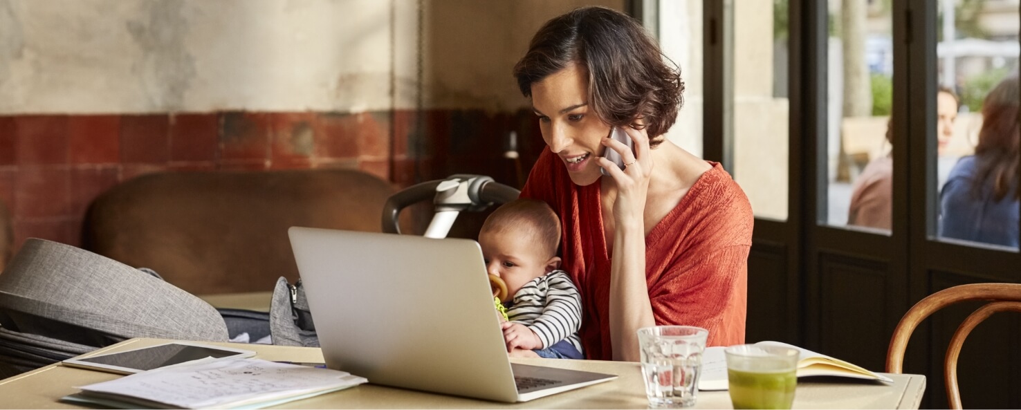 woman on a couch looking at laptop